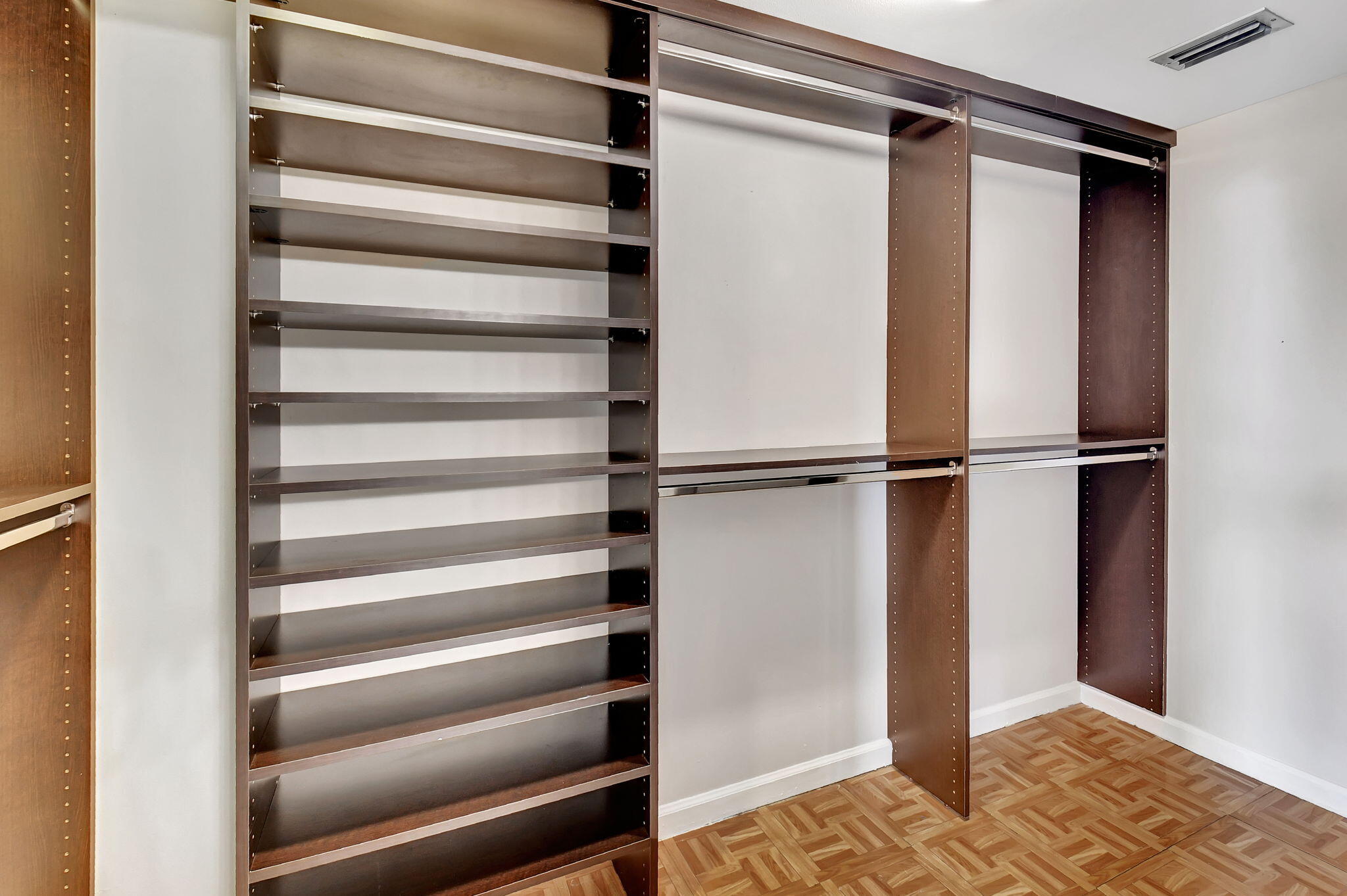 6372 La Costa Drive, Unit 302 Boca Raton, FL 33433 - Photo 33 of 52 a view of walk in closet with empty racks