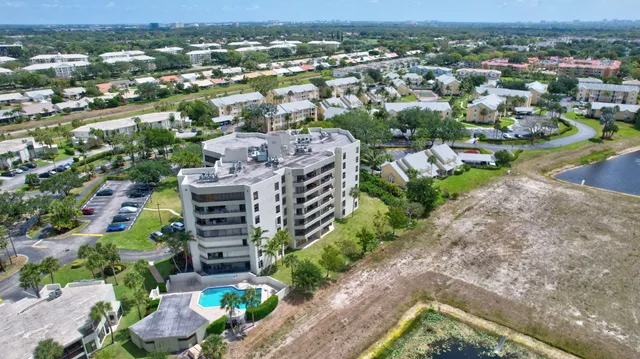 an aerial view of a house with a garden and plants