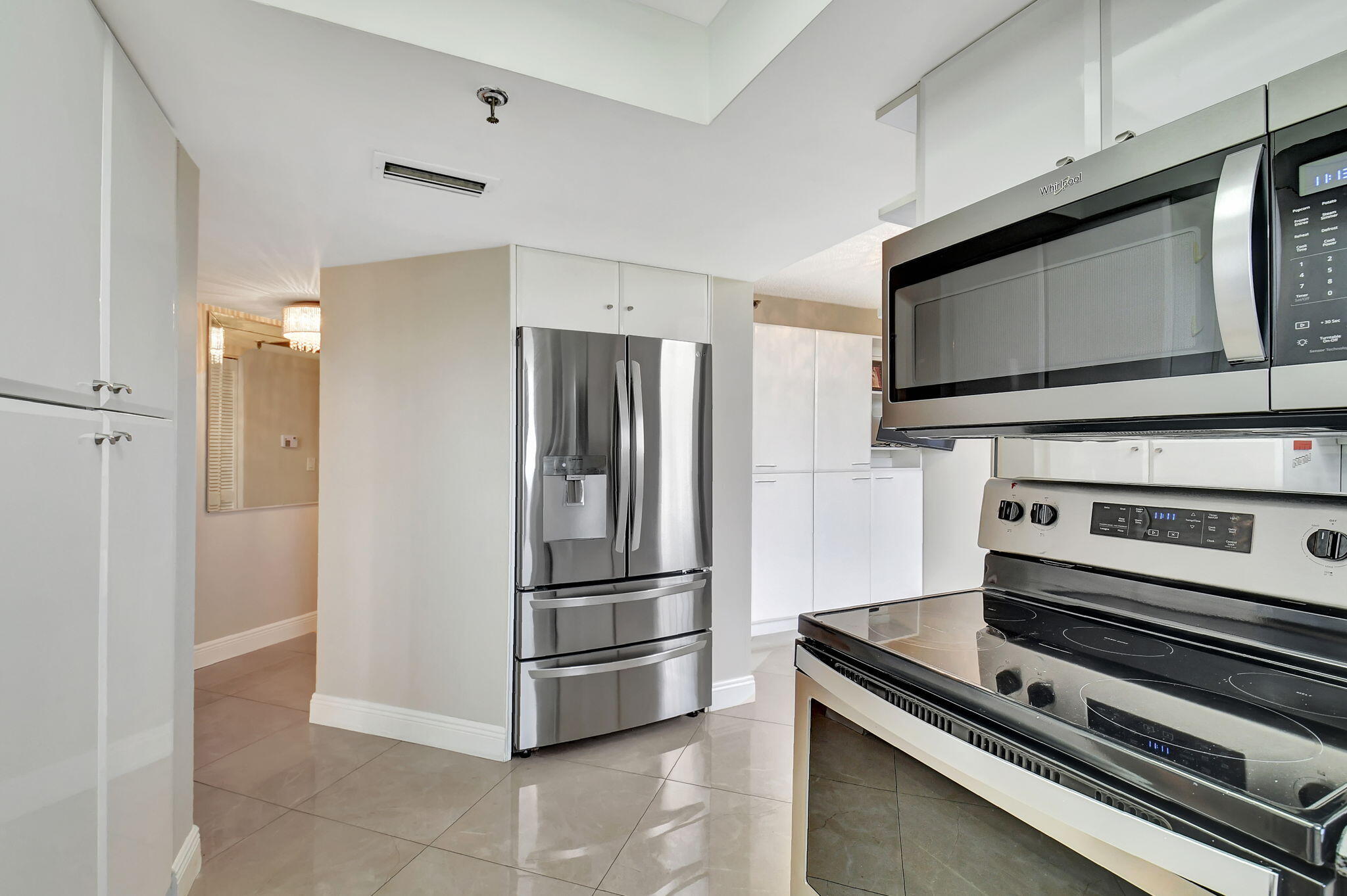 6372 La Costa Drive, Unit 302 Boca Raton, FL 33433 - Photo 7 of 52 a kitchen with appliances and cabinets