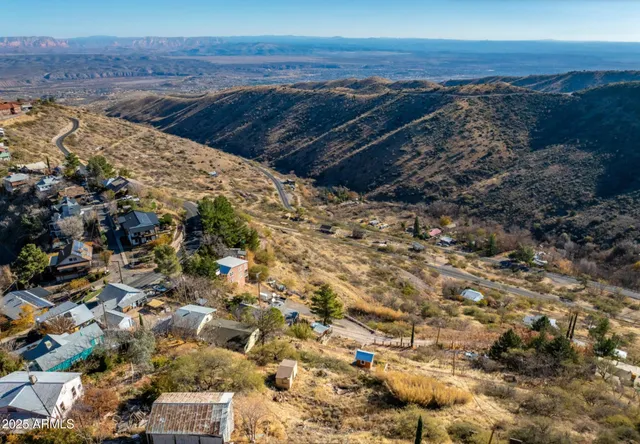 a view of a large body of water with a building in the background