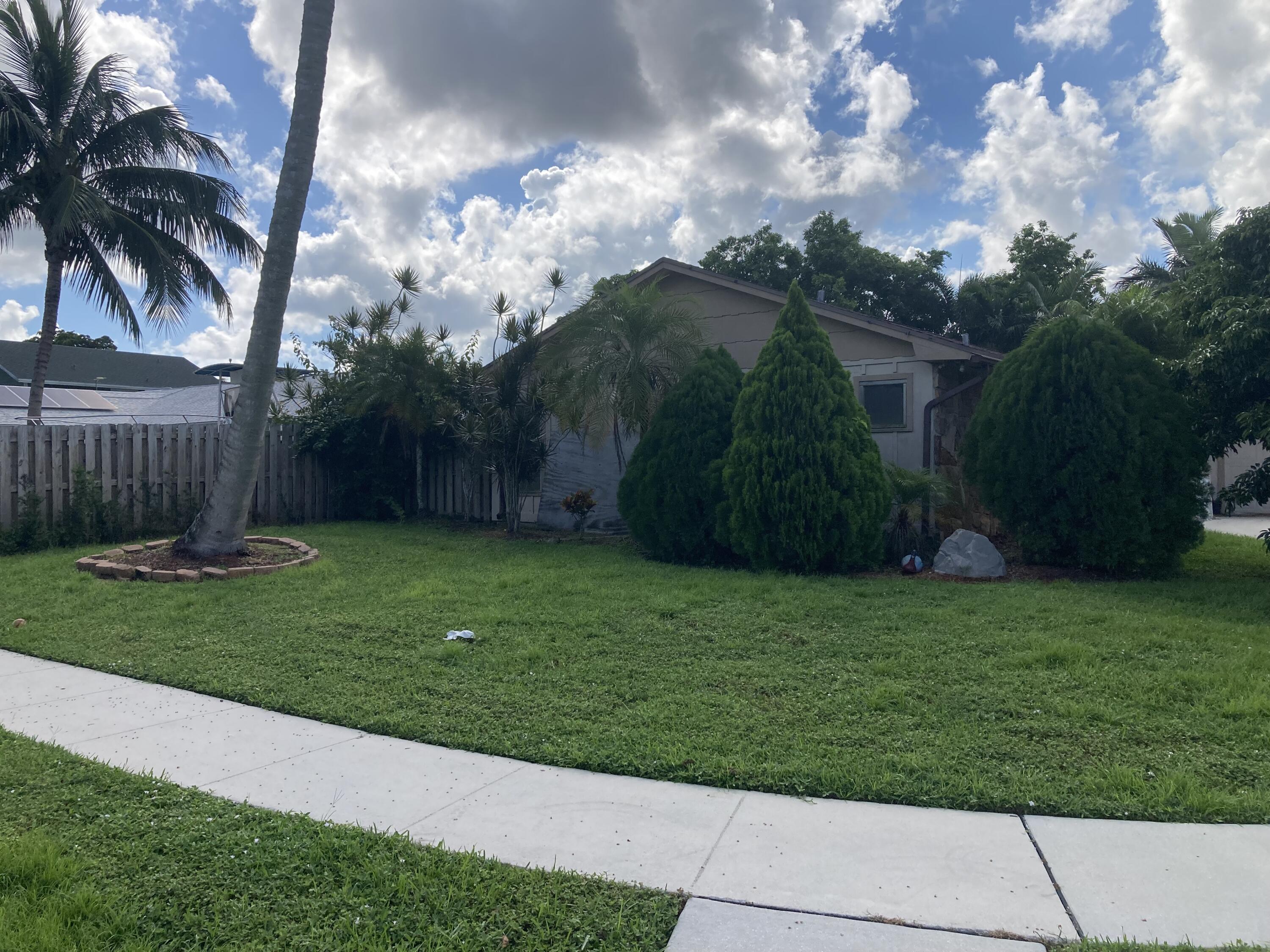 1156 Block Island Road Wellington, FL 33414 - Photo 2 of 15 a view of a back yard