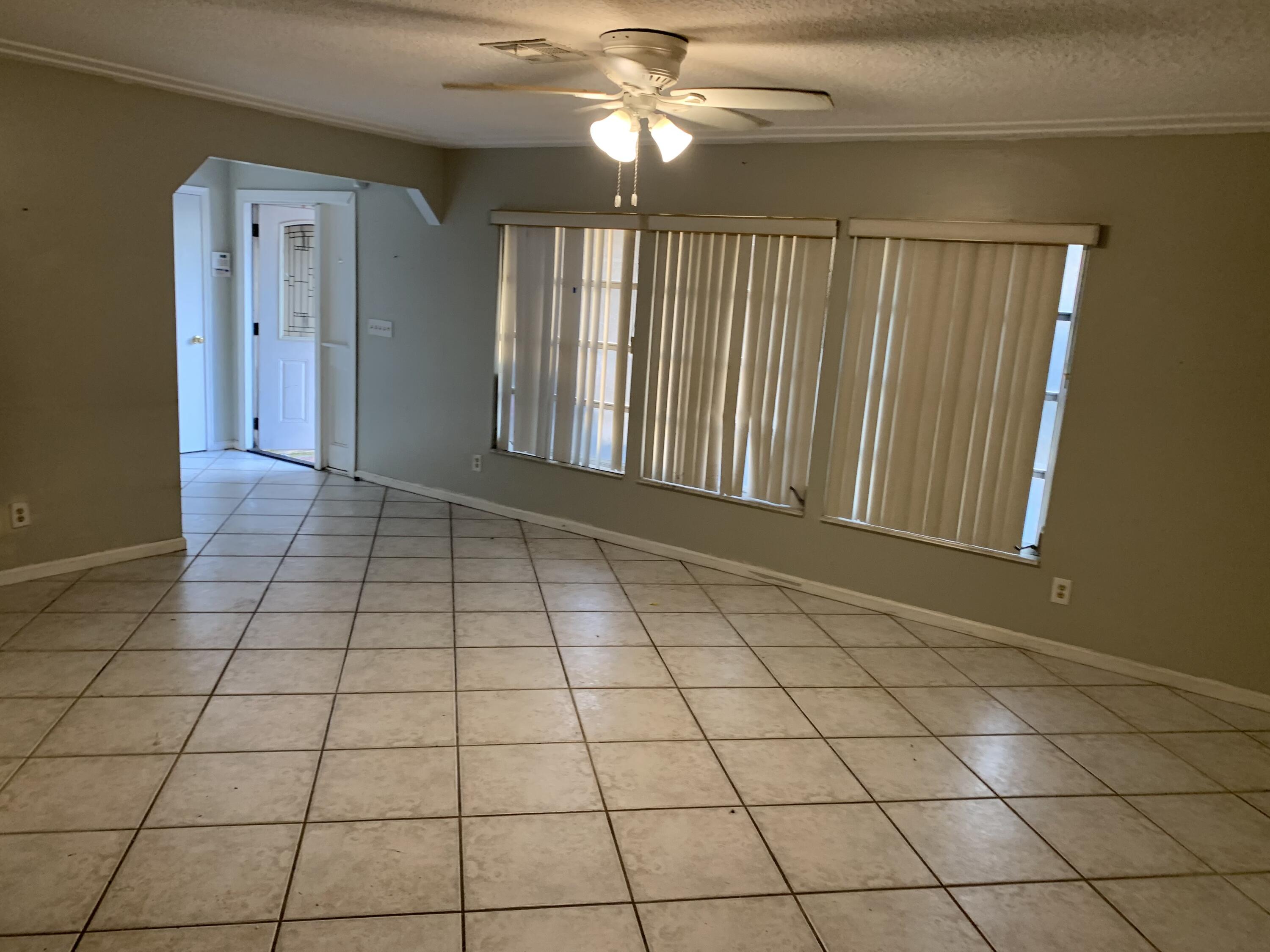 1156 Block Island Road Wellington, FL 33414 - Photo 3 of 15 a view of an empty room and window