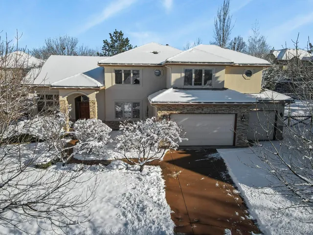 a front view of a house with yard and seating area