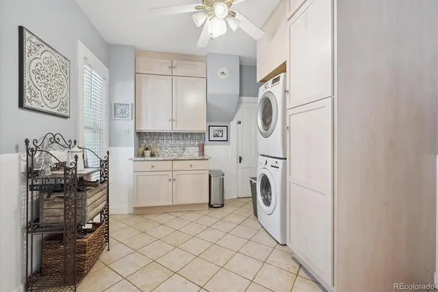 a kitchen with a refrigerator a washer and dryer