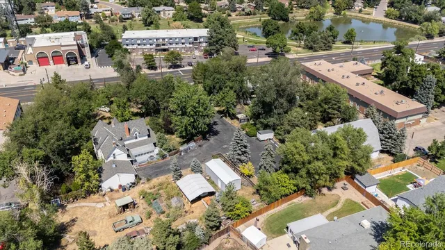 an aerial view of a house with a yard