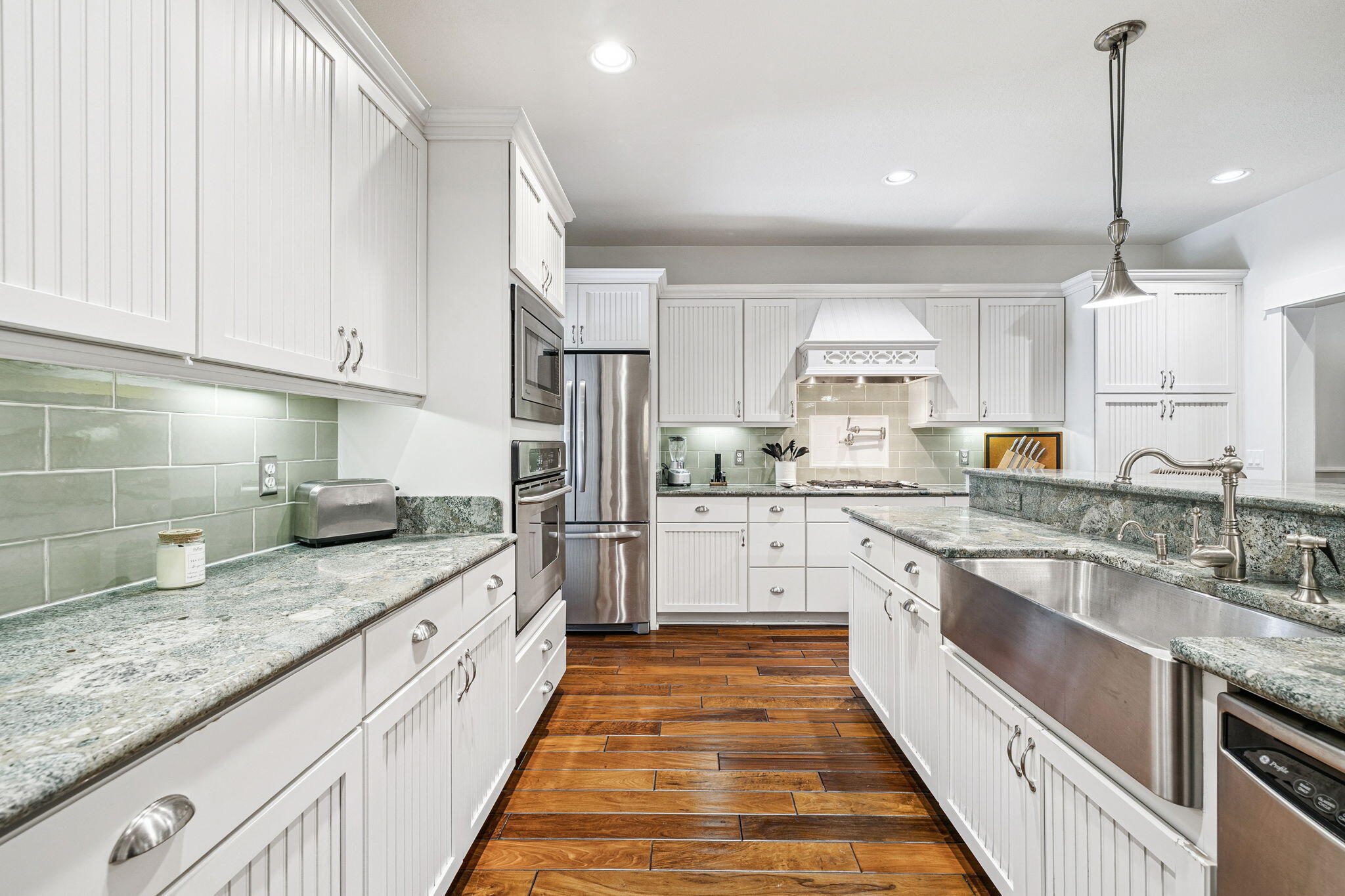 76 Crescent Road Santa Rosa Beach, FL 32459 - Photo 20 of 104 a large kitchen with stainless steel appliances granite countertop a sink and a stove