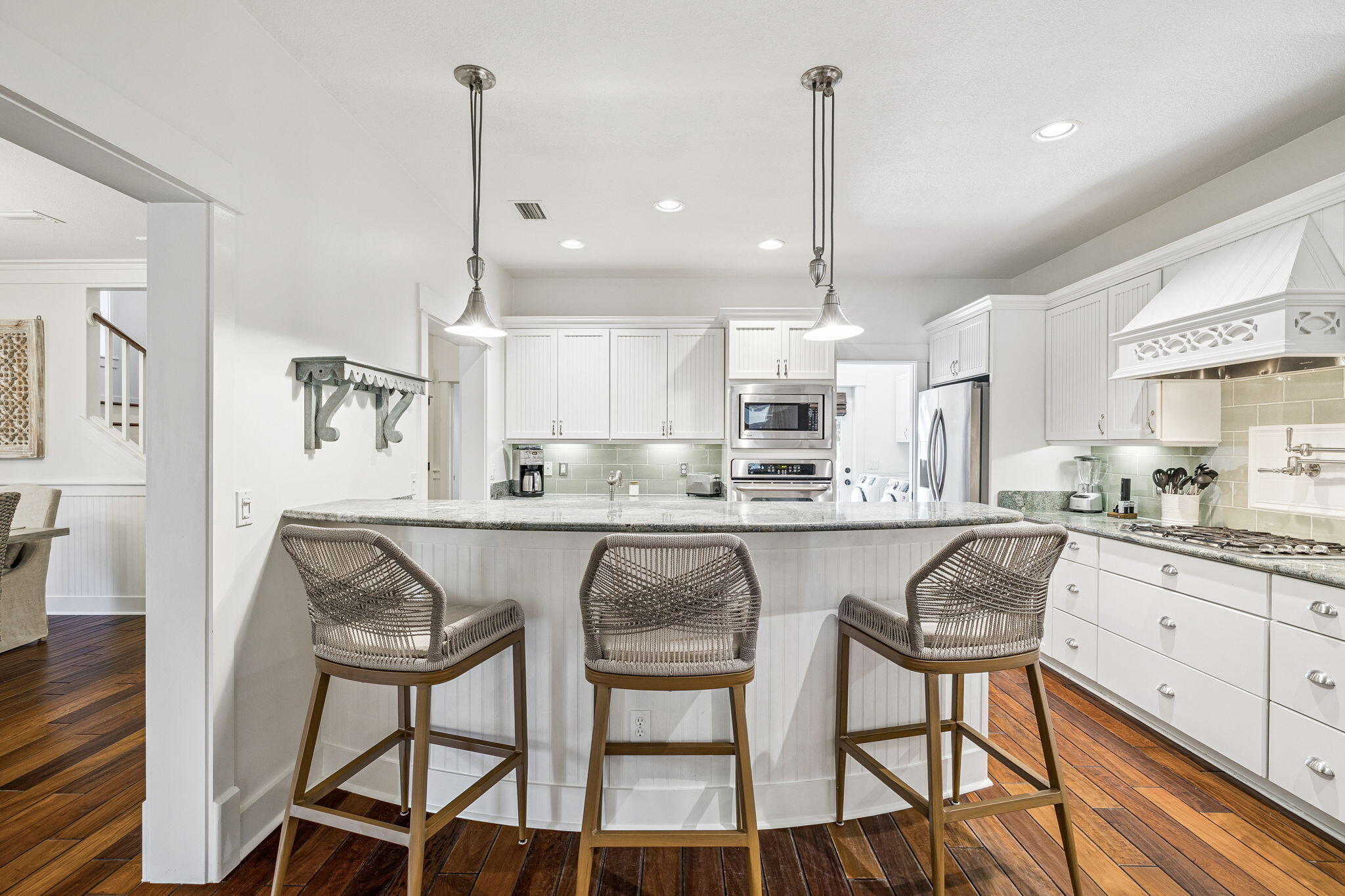 76 Crescent Road Santa Rosa Beach, FL 32459 - Photo 25 of 104 a kitchen with stainless steel appliances granite countertop white cabinets and wooden floor