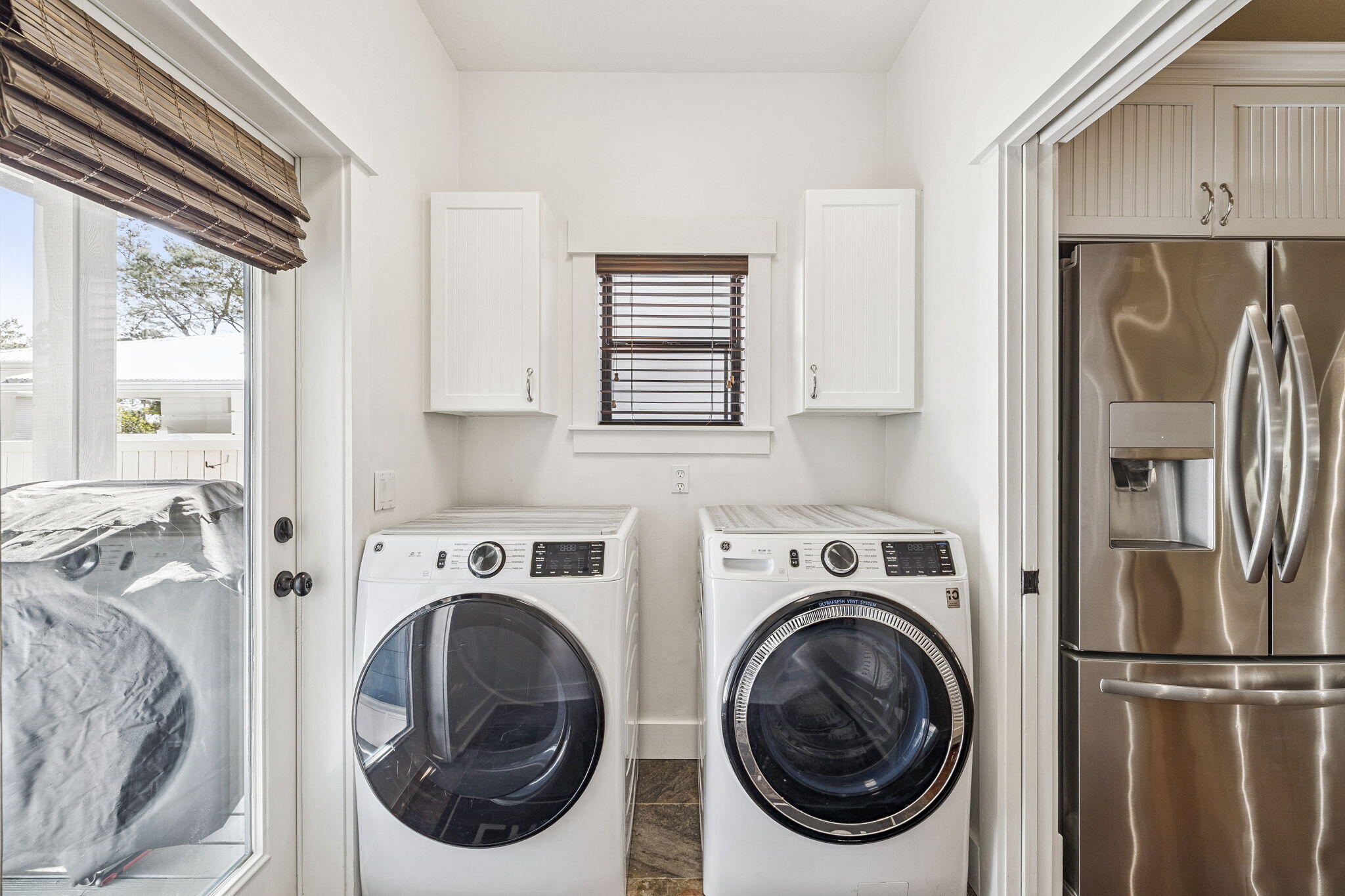 76 Crescent Road Santa Rosa Beach, FL 32459 - Photo 28 of 104 a utility room with dryer washer and a view of bedroom