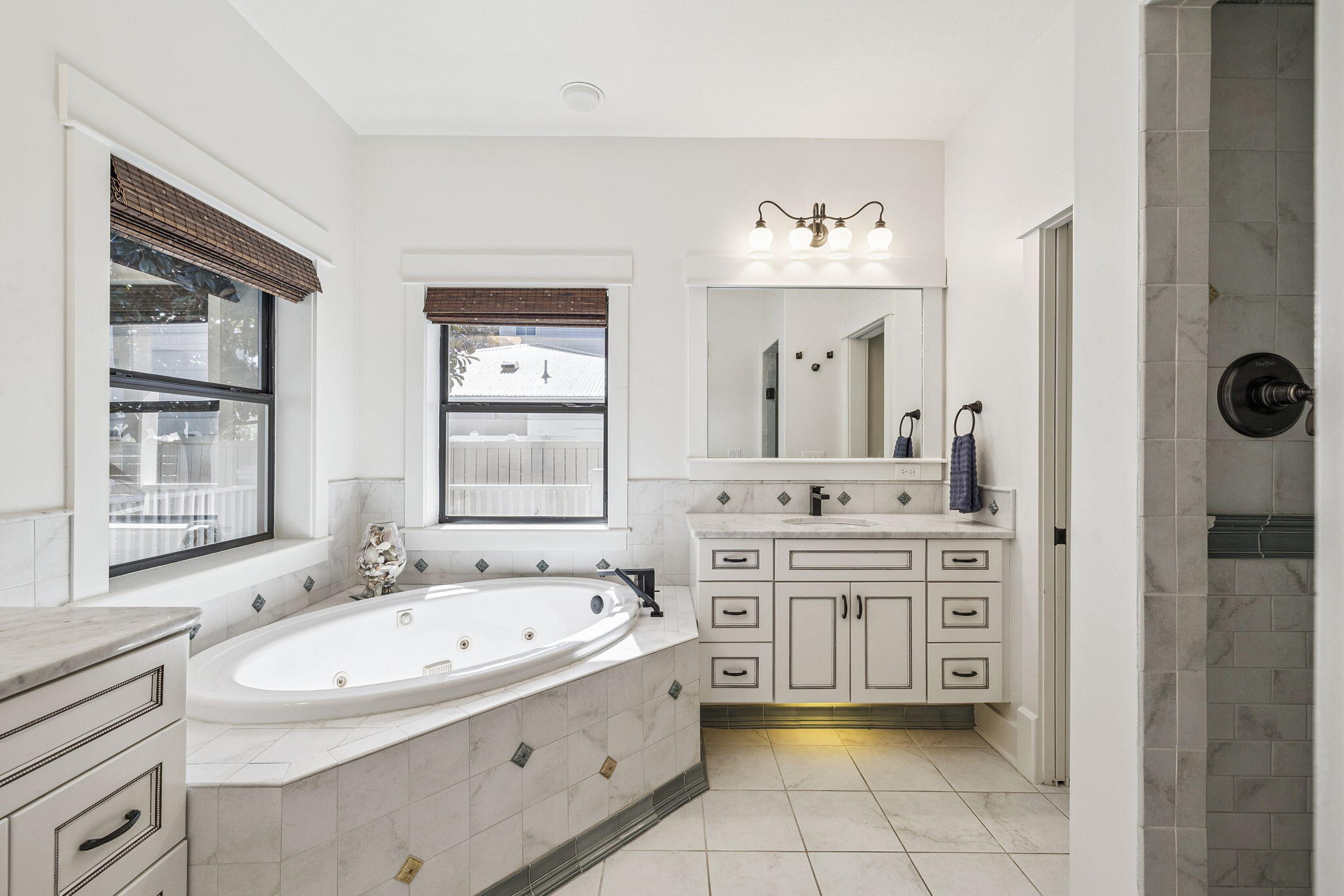 76 Crescent Road Santa Rosa Beach, FL 32459 - Photo 35 of 104 a bathroom with a granite countertop sink mirror and bathtub