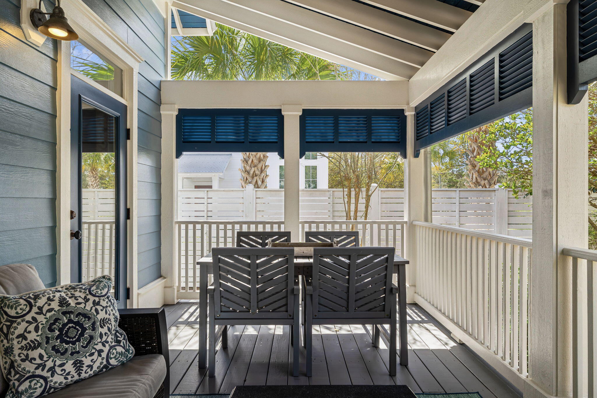 76 Crescent Road Santa Rosa Beach, FL 32459 - Photo 53 of 104 a view of a patio with table and chairs and wooden floor
