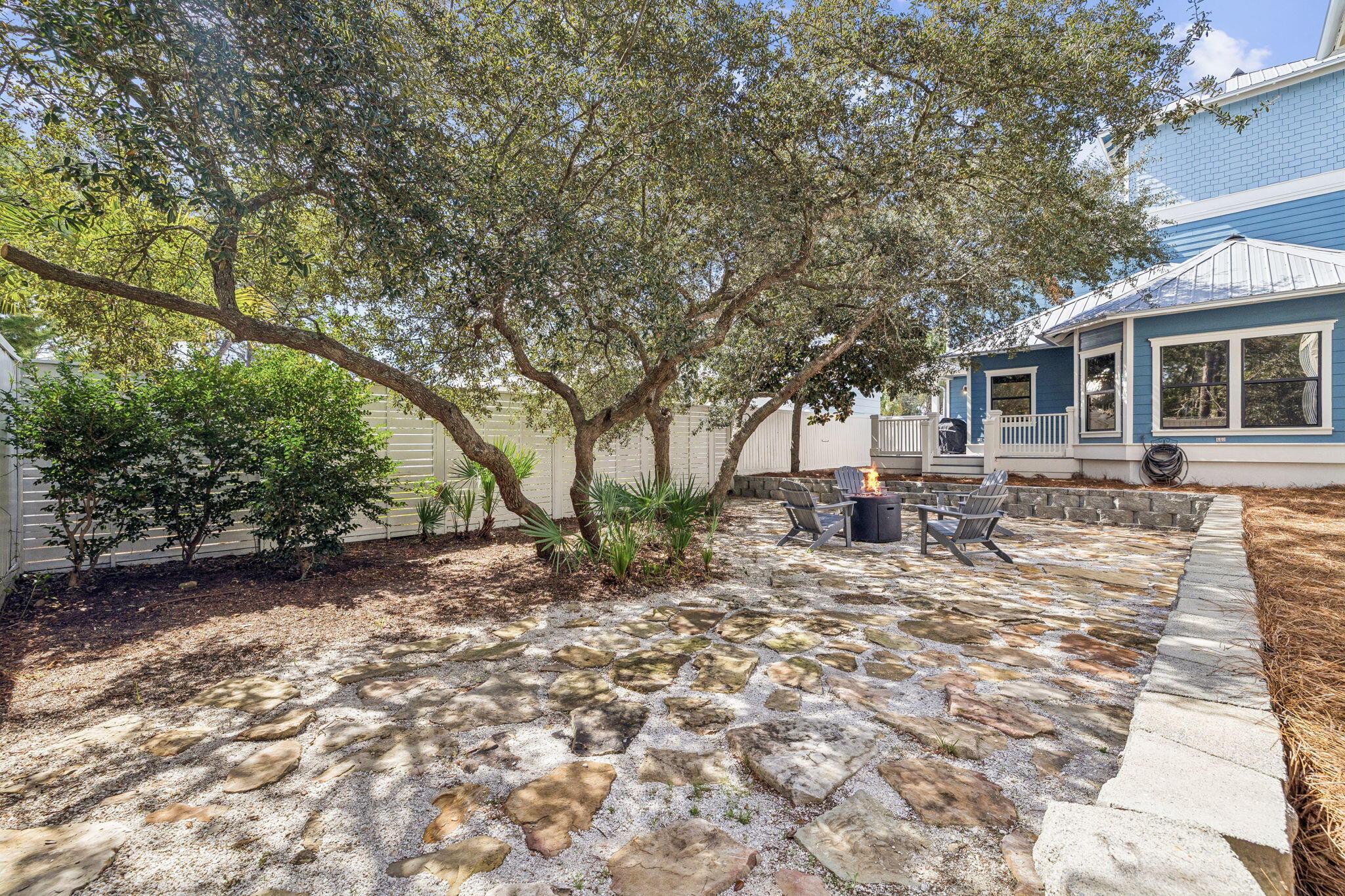 76 Crescent Road Santa Rosa Beach, FL 32459 - Photo 54 of 104 a view of a yard with a house and a tree