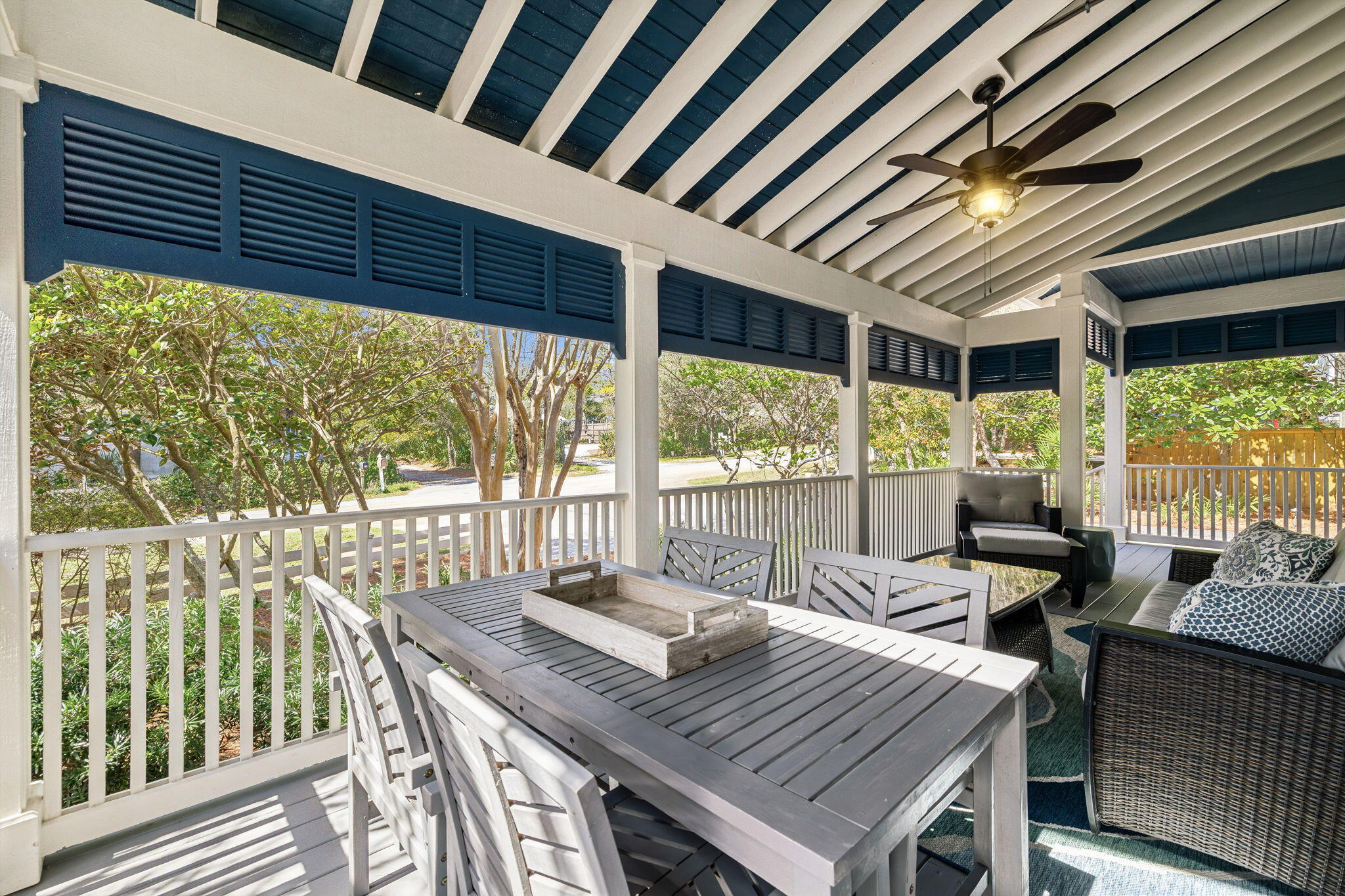76 Crescent Road Santa Rosa Beach, FL 32459 - Photo 62 of 104 a view of a patio with table and chairs and wooden floor