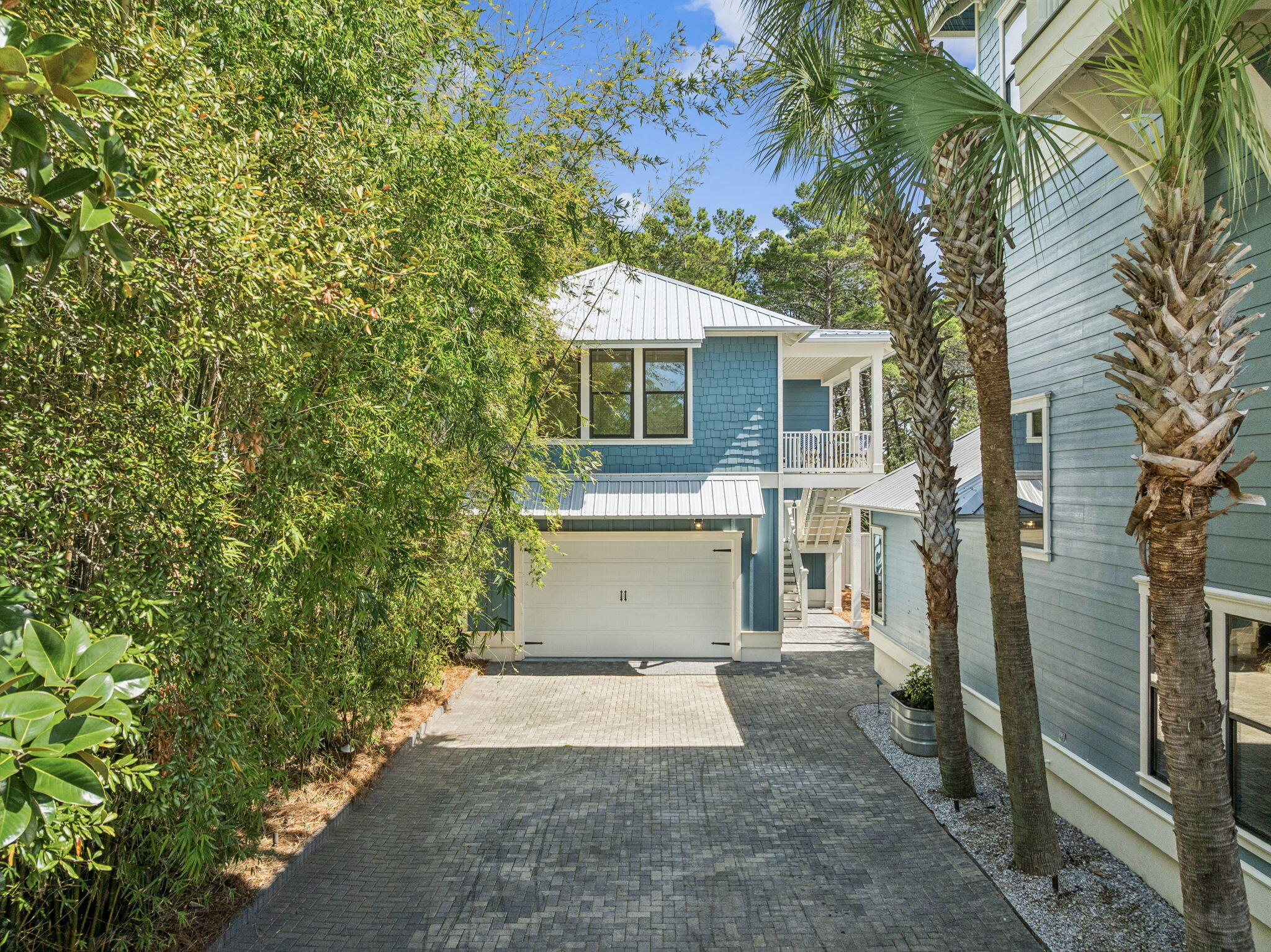 76 Crescent Road Santa Rosa Beach, FL 32459 - Photo 68 of 104 a front view of a house with a yard and garage