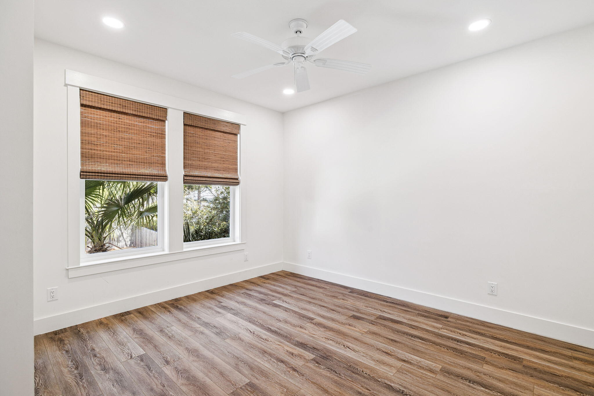 76 Crescent Road Santa Rosa Beach, FL 32459 - Photo 78 of 104 an empty room with wooden floor and windows