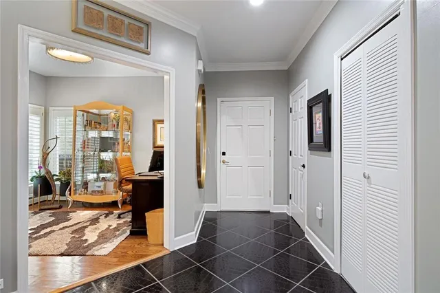 a view of a livingroom with wooden floor and furniture