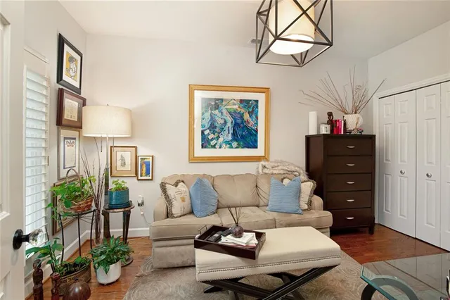 a view of a balcony with wooden floor and fence
