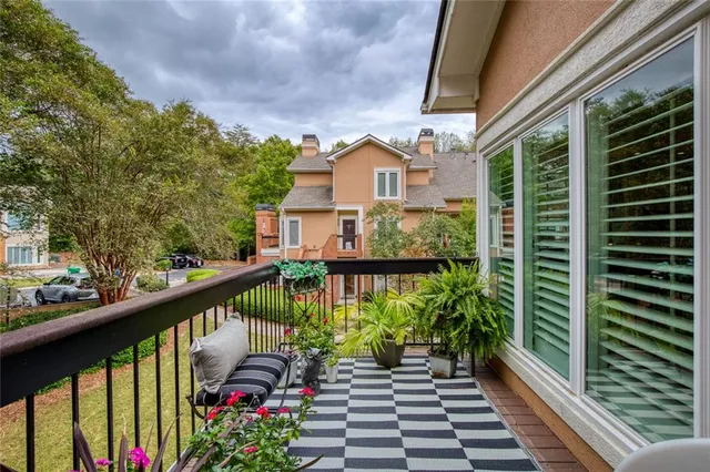 a view of balcony with a yard