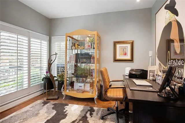 a dining room with furniture and a window