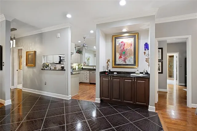 a kitchen with stainless steel appliances a refrigerator and cabinets