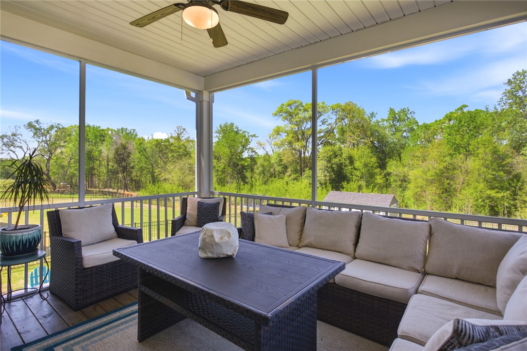 318 Summerall Drive Anderson, SC 29621 - Photo 32 of 42 Enjoy tranquil outdoor living on this expansive screened porch overlooking lush greenery.