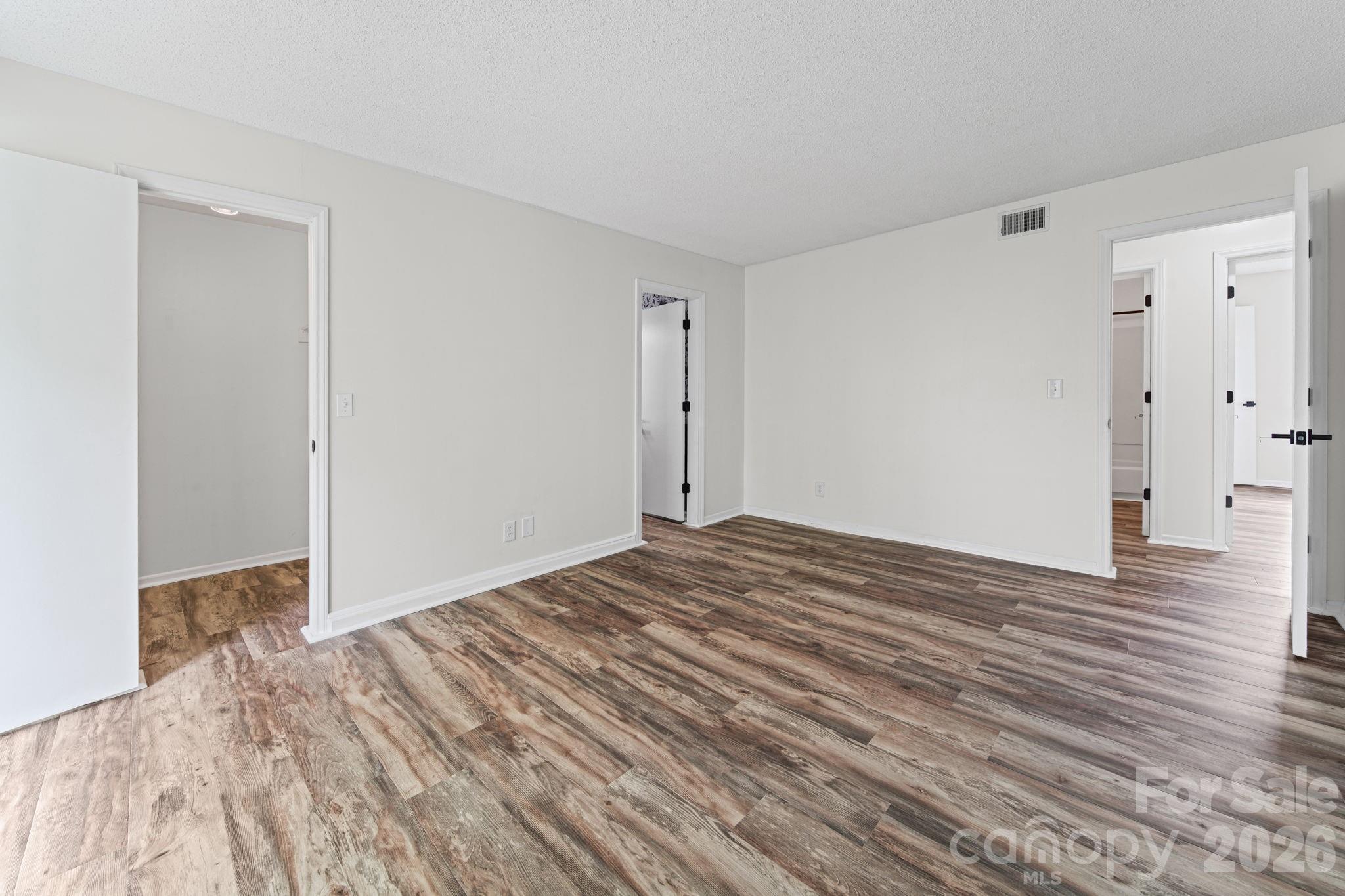 11023 Harrowfield Road Charlotte, NC 28226 - Photo 17 of 32 a view of empty room with wooden floor