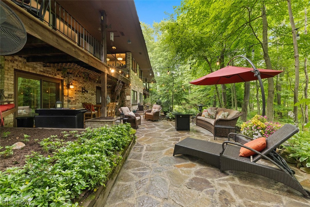 171 Granger Road, Unit 107 Medina, OH 44256 - Photo 35 of 41 Expansive flagstone patio surrounded by lush landscaping and mature trees & a Koi pond. Fish do not stay.