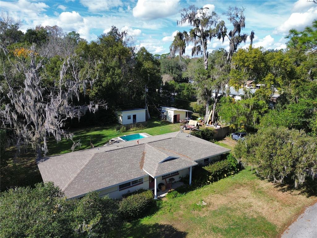 1324 Southeast 33rd Terrace Ocala, FL 34471 - Photo 3 of 6 an aerial view of a house with swimming pool and garden