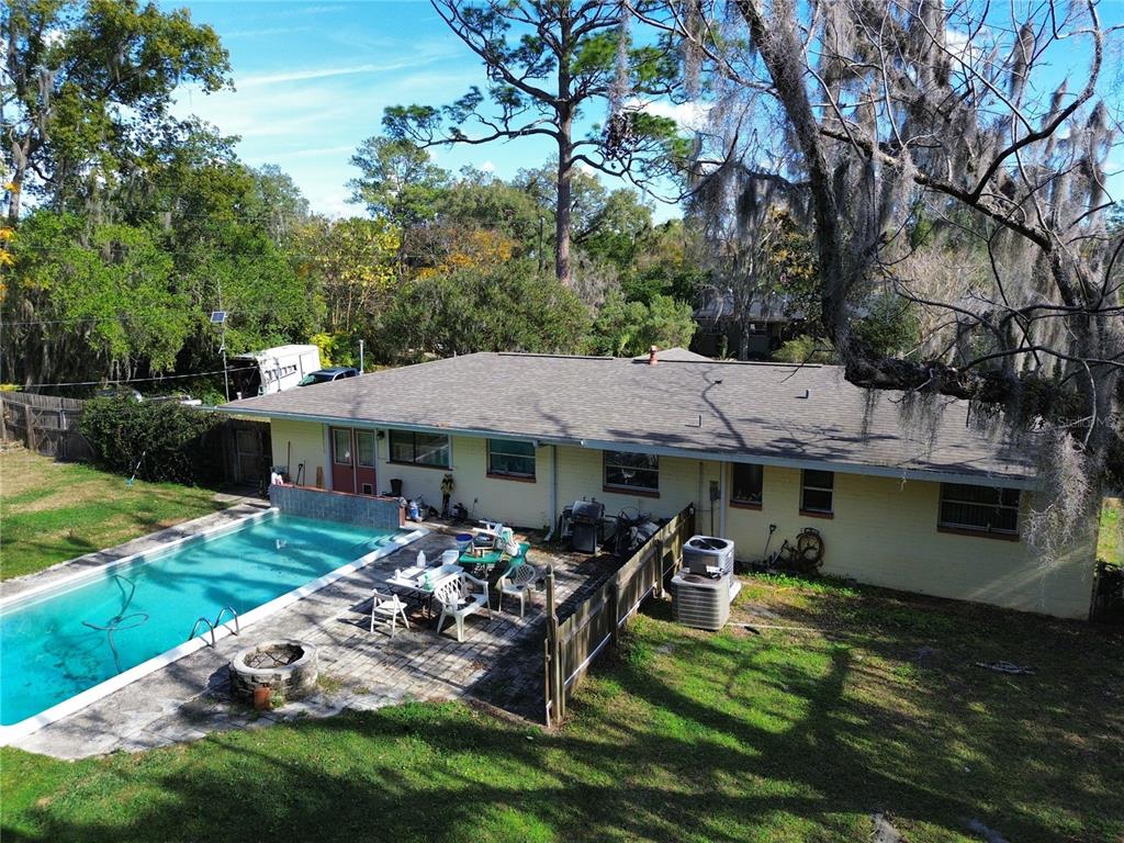 1324 Southeast 33rd Terrace Ocala, FL 34471 - Photo 5 of 6 a view of a house with backyard porch and sitting area