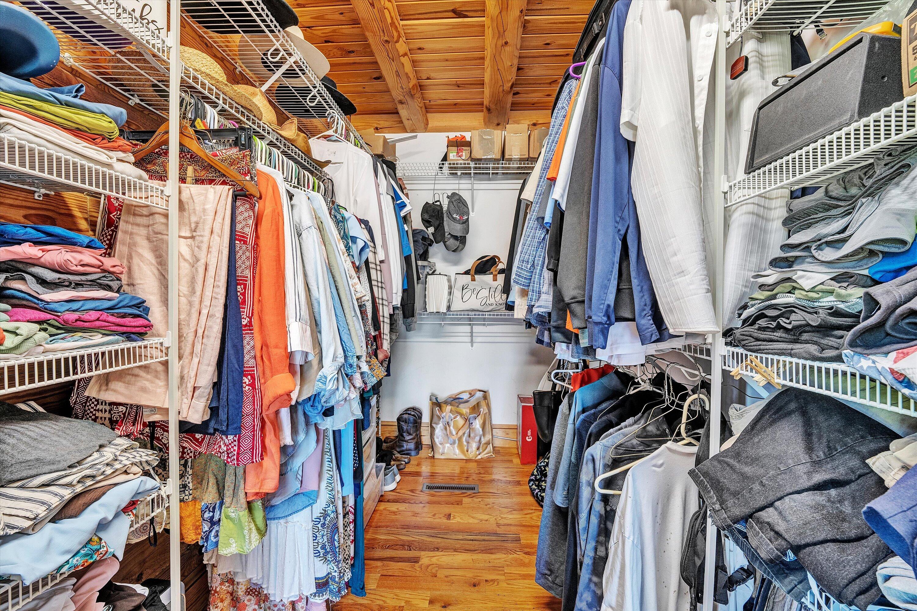 180 Thompson Ridge Circle Ferrum, VA 24088 - Photo 32 of 74 a view of walk in closet with clothes and shoes