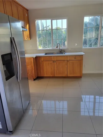 a living room with a couch a table and a large window