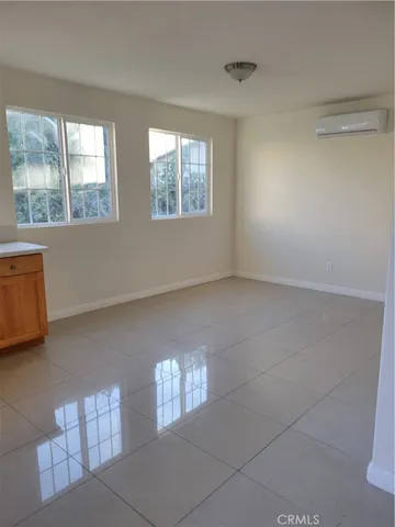 a view of an empty room with windows