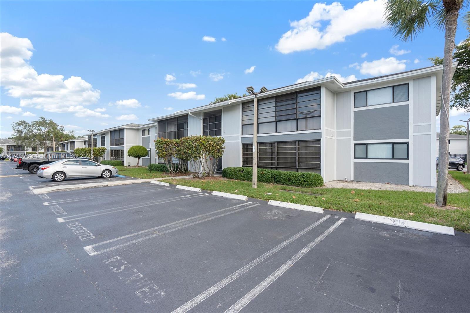 a car parked in front of white house