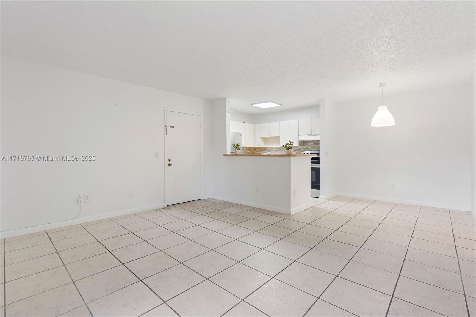 9729 Hammocks Boulevard, Unit 106E Miami, FL 33196 - Photo 5 of 25 a view of a kitchen with a sink