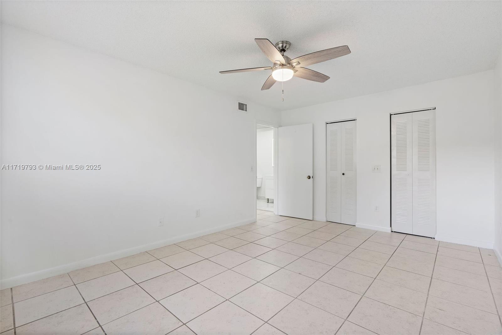 9729 Hammocks Boulevard, Unit 106E Miami, FL 33196 - Photo 8 of 25 a view of an empty room