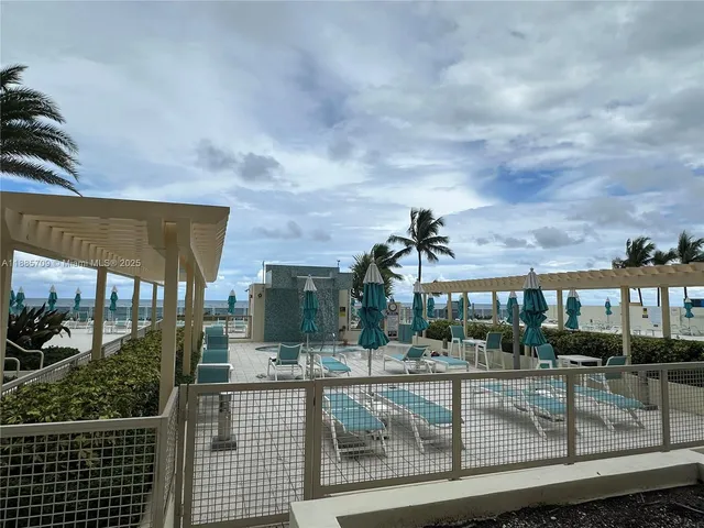 a view of a swimming pool with a patio