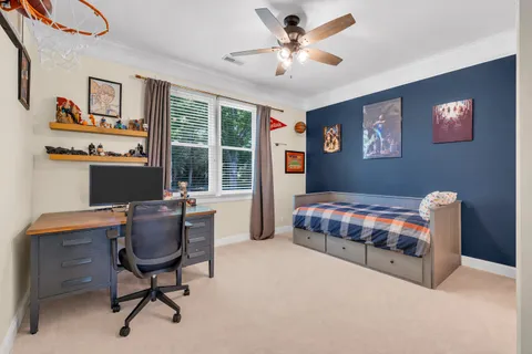 a bedroom with bed and a window