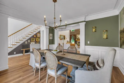 a view of a dining room with furniture window and wooden floor