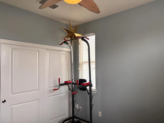 a living room with a couch and a chandelier