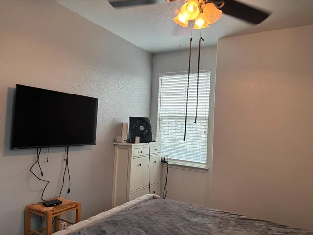 a white toilet sitting next to a bathroom sink