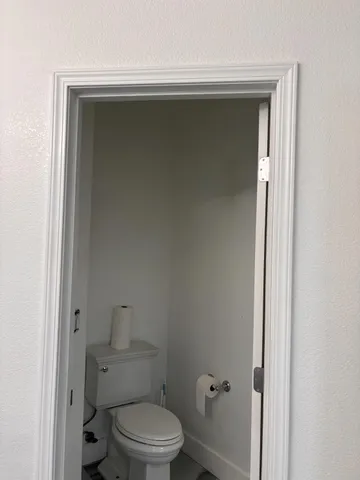 a front view of a house with plants