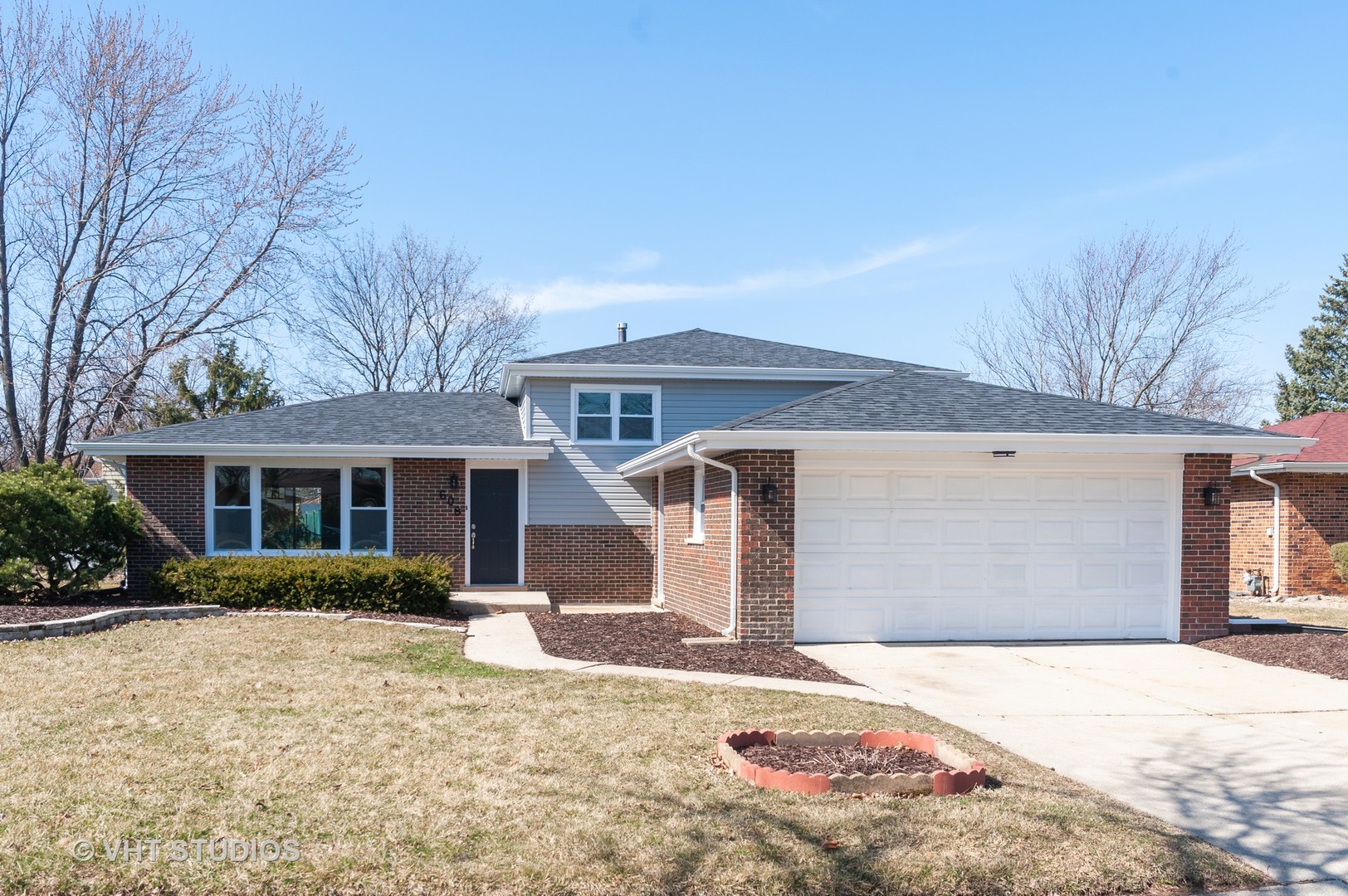 608 Willow Road Matteson, IL 60443 - Photo 1 of 15 a front view of a house with garden