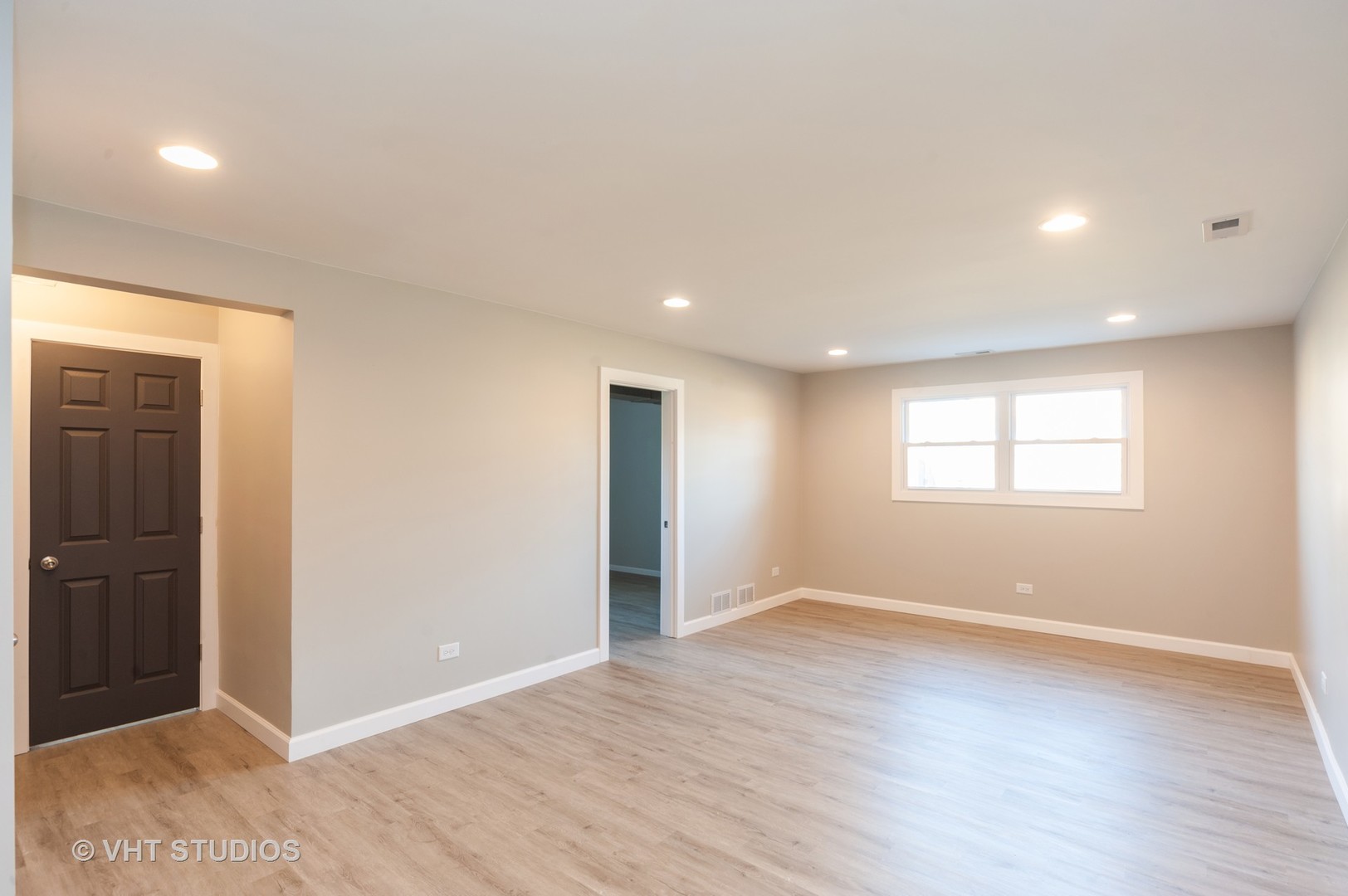 608 Willow Road Matteson, IL 60443 - Photo 13 of 15 an empty room with wooden floor and windows