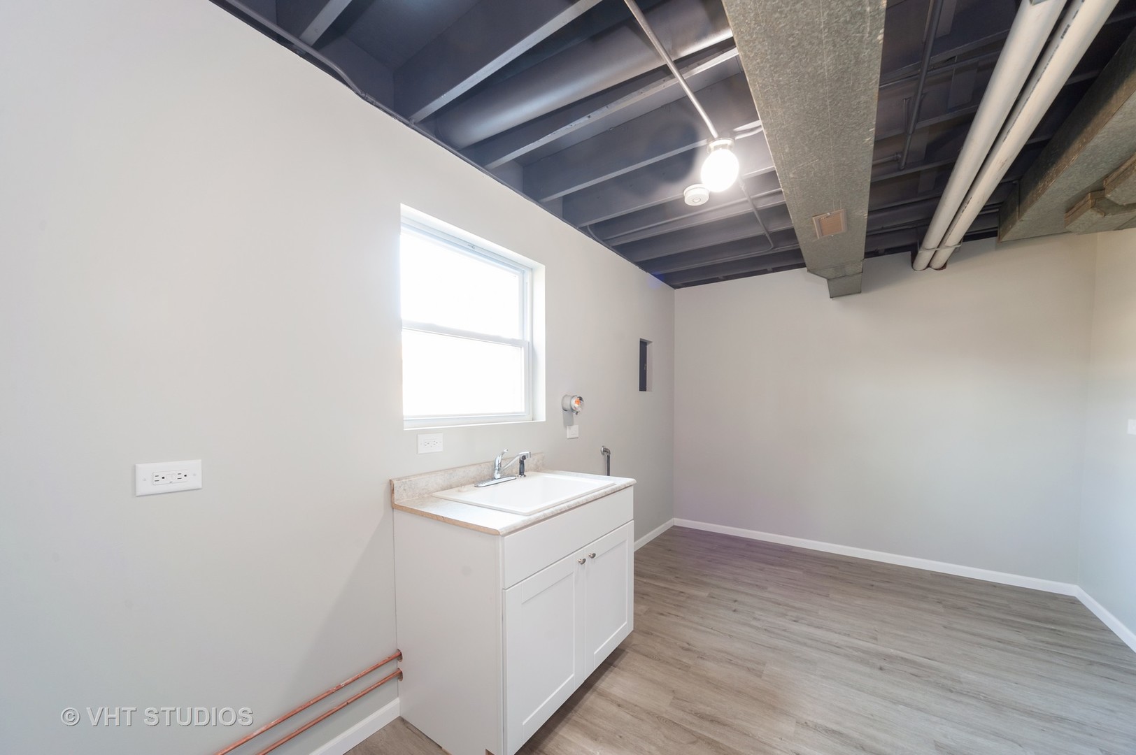 608 Willow Road Matteson, IL 60443 - Photo 14 of 15 a bathroom with a sink and a window
