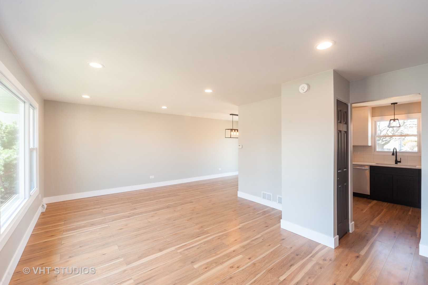 608 Willow Road Matteson, IL 60443 - Photo 6 of 15 a view of an empty room with wooden floor and a window