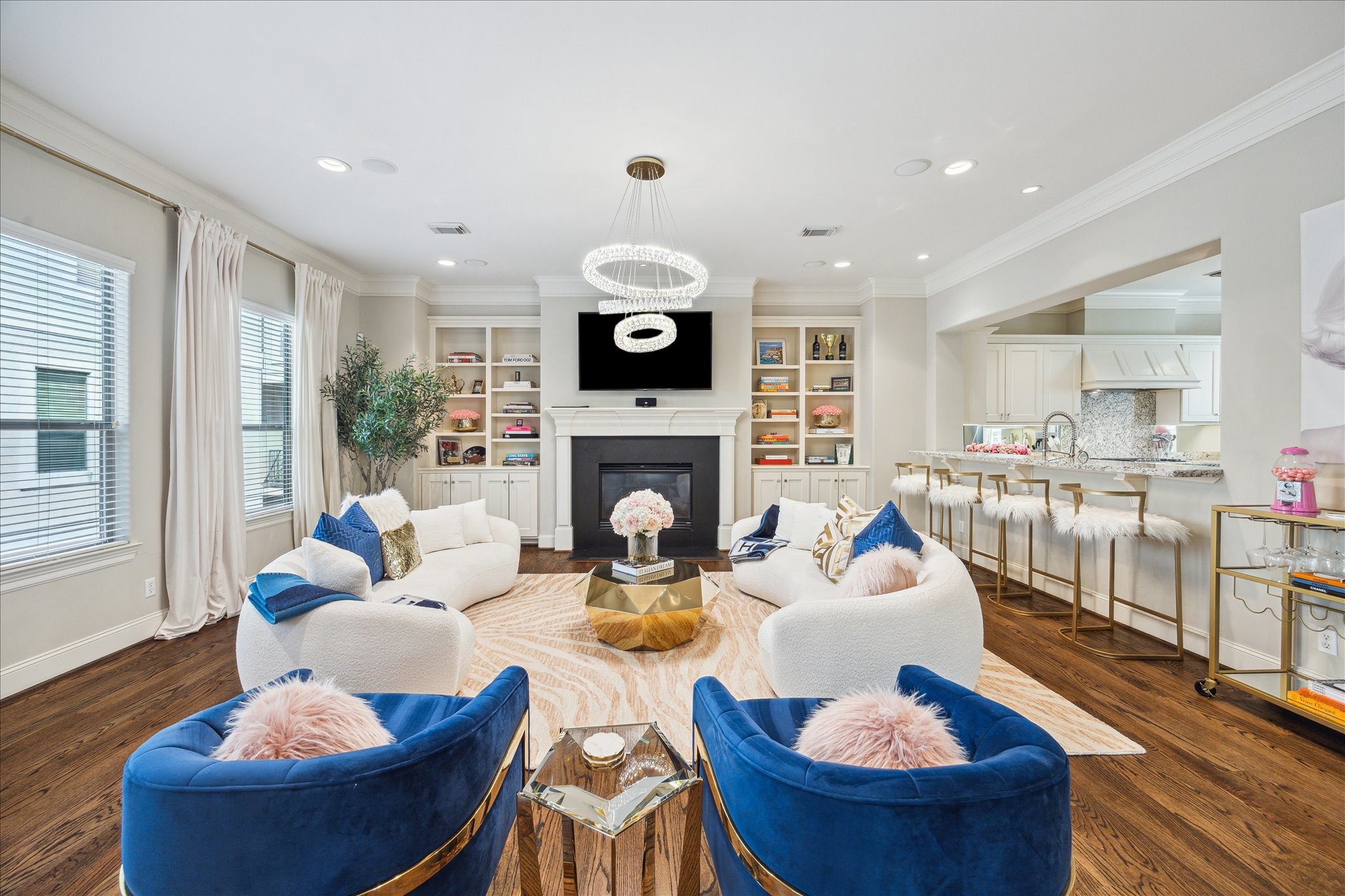 4724 Banning Drive, Unit A Houston, TX 77027 - Photo 13 of 34 A breathtaking new chandelier from Ferguson Home serves as the room’s captivating centerpiece. Expansive windows and exquisite custom built-ins showcase your books and décor, while the space gracefully opens to the kitchen and dining areas.