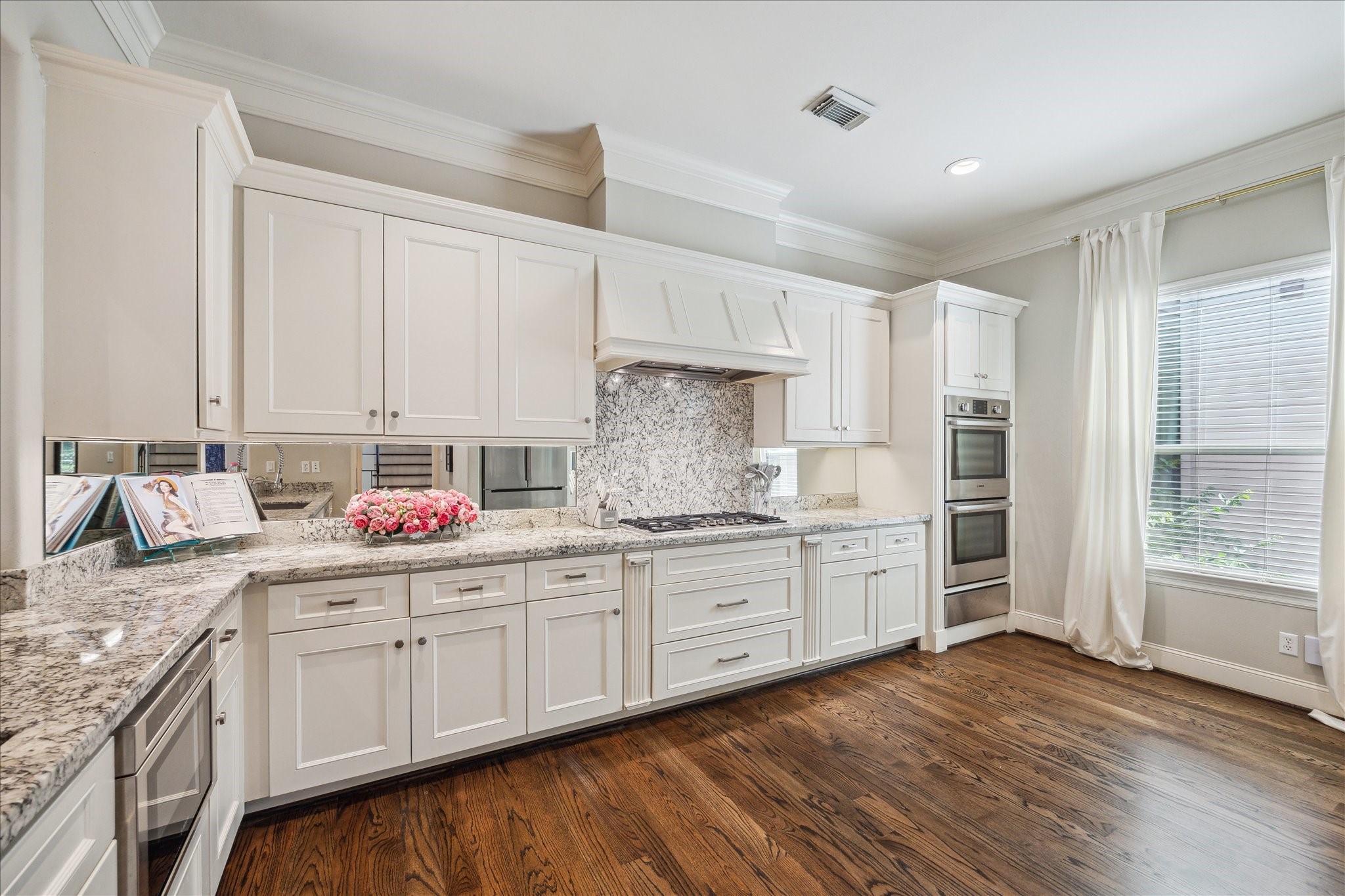 4724 Banning Drive, Unit A Houston, TX 77027 - Photo 19 of 34 This kitchen offers abundant cabinet space to accommodate all your cookware and essentials. Featuring a Bosch gas range, it’s perfectly designed for both cooking and entertaining. A large window offers a ton of natural light into the space.