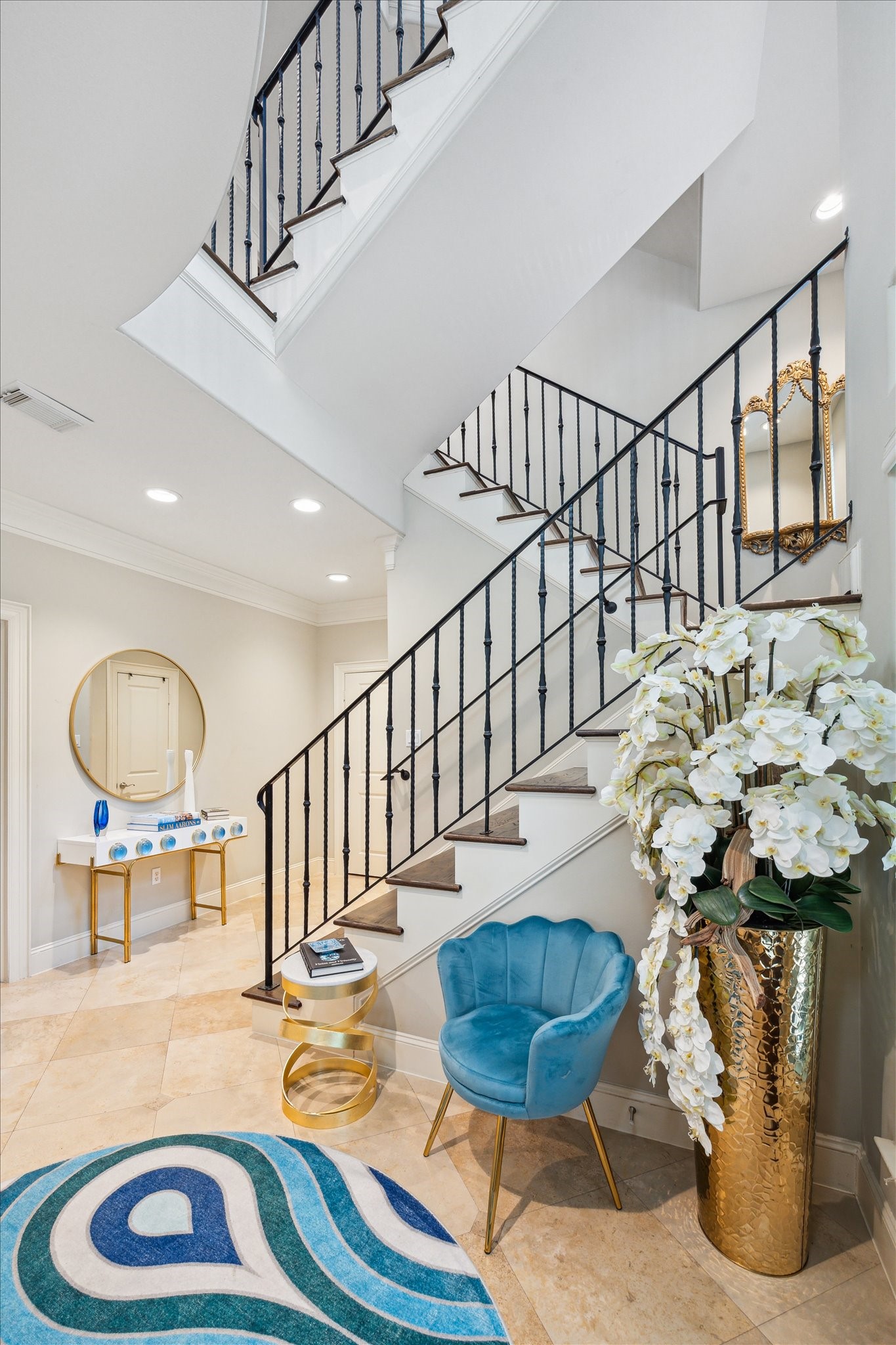 4724 Banning Drive, Unit A Houston, TX 77027 - Photo 7 of 34 A grand staircase guides you to the expansive second floor, thoughtfully designed for effortless entertaining.