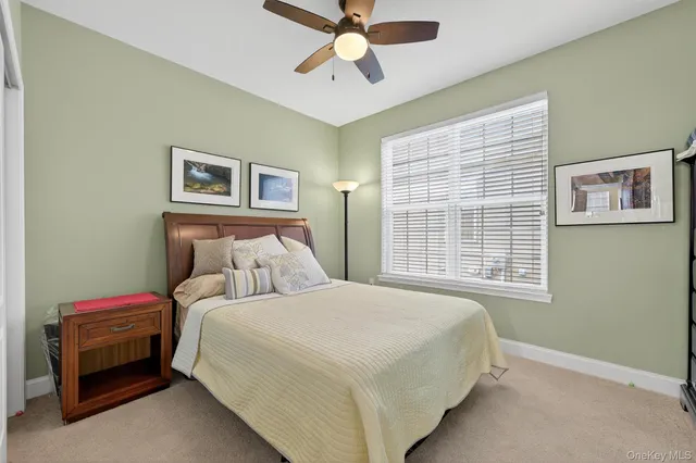 a bedroom with bed and window