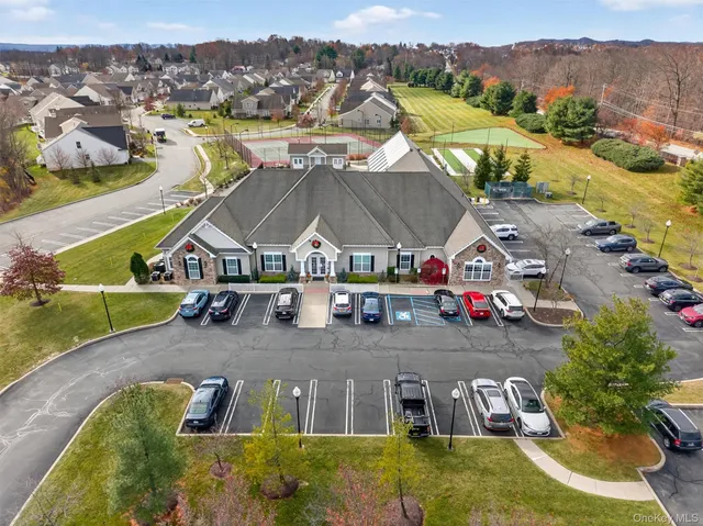 an aerial view of houses with a swimming pool