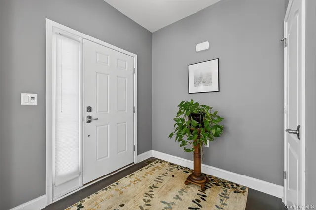 a view of a hallway with a flower pot